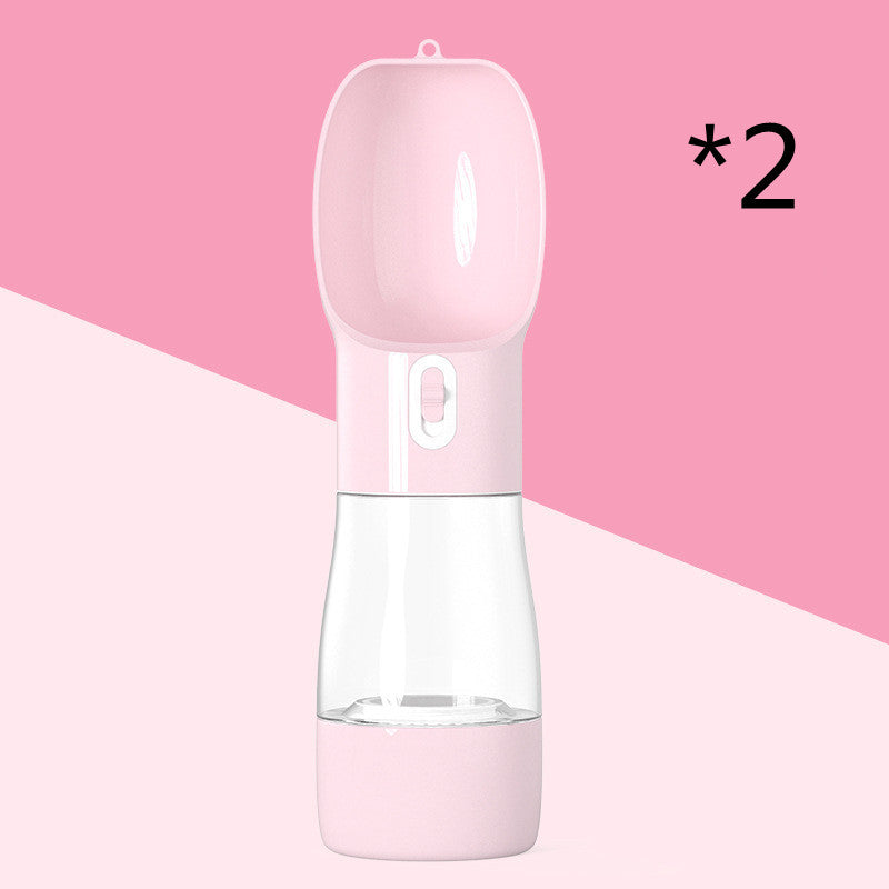 Portable pink dog water dispenser with a detachable bowl, ideal for travel and outdoor activities.