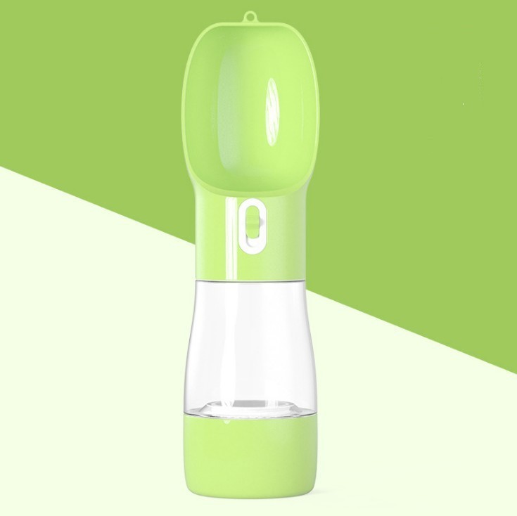 Portable dog water dispenser in green color, designed for outdoor travel and easy pet hydration.
