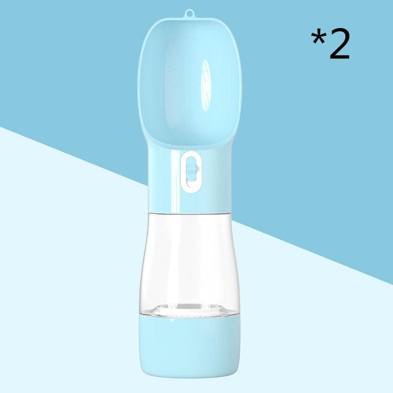 Portable dog water dispenser in blue, designed for outdoor travel with food and water capacity.