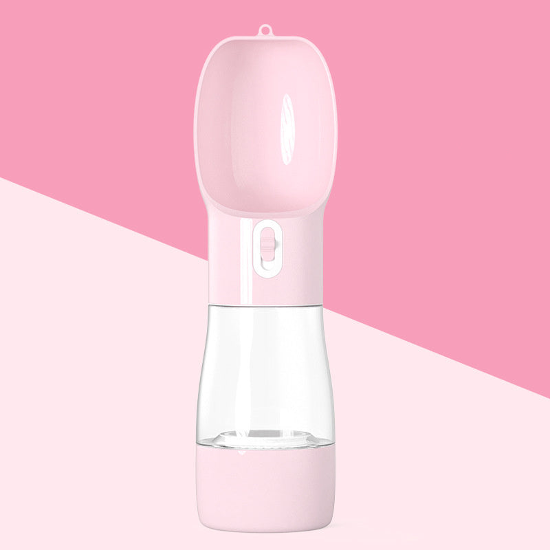 Portable pink dog water dispenser with a retractable bowl for easy travel and hydration.