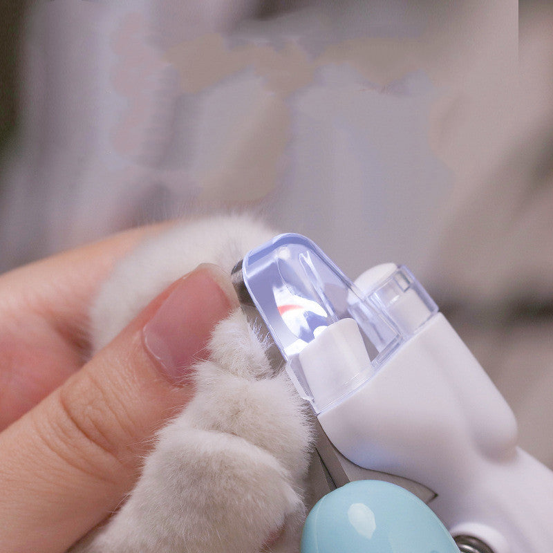 LED electric pet nail clippers trimming a small cat's nail safely and efficiently.