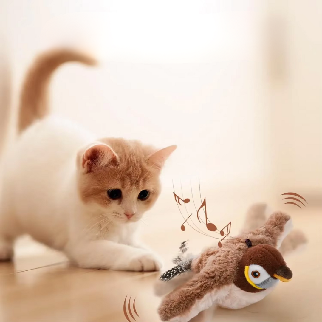 Playful cat interacting with the CatCatch interactive self-flying bird toy, mimicking real bird movements.