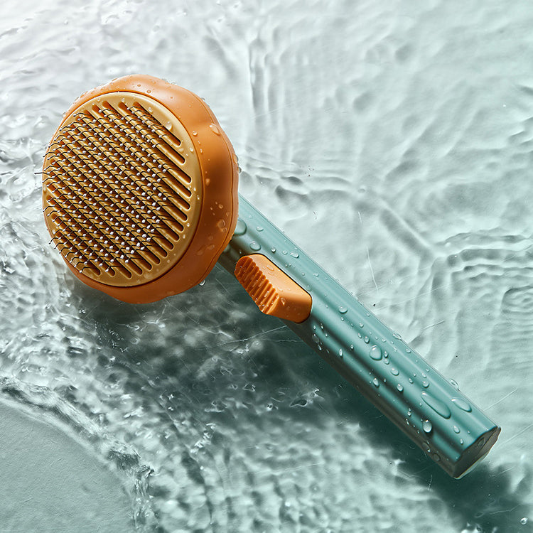 Cute pumpkin-shaped pet grooming comb, perfect for detangling and removing loose fur gently.