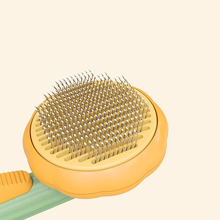 Cute Pumpkin Pet Grooming Comb with fine wire bristles for gentle detangling and removing loose fur.